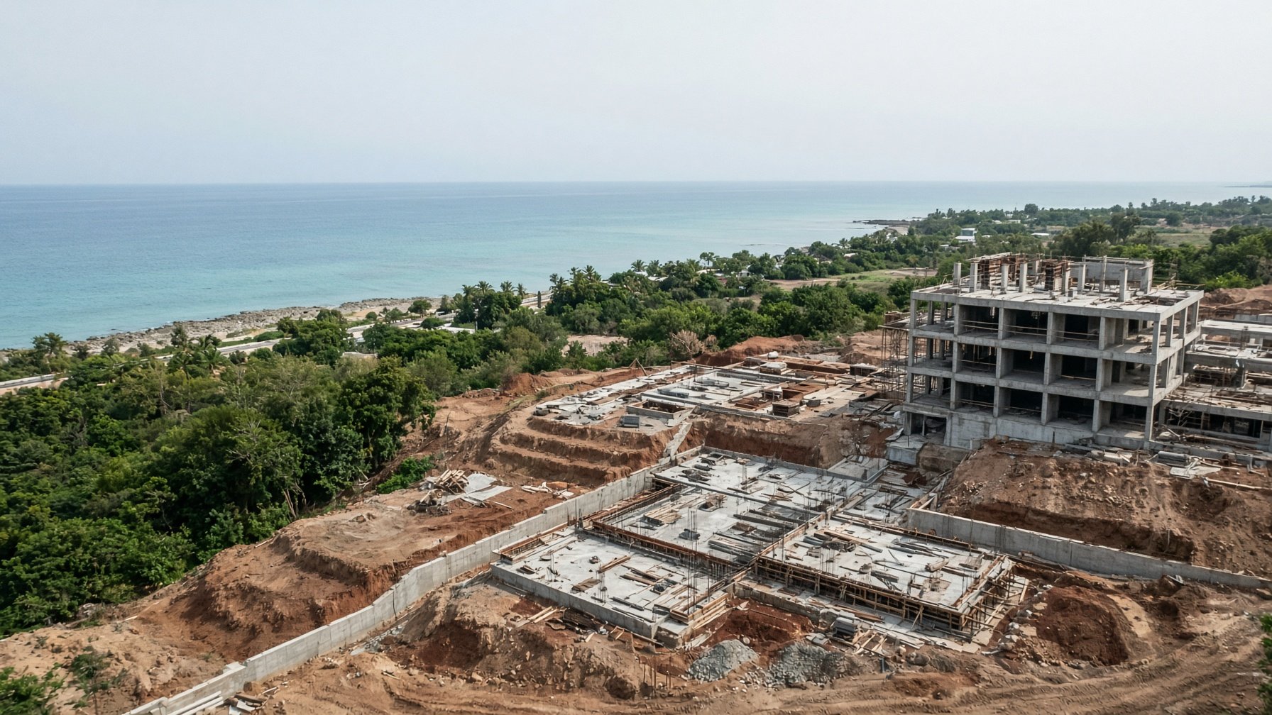 Aerial photograph of a construction site beside a tropical coast in Mauritius.